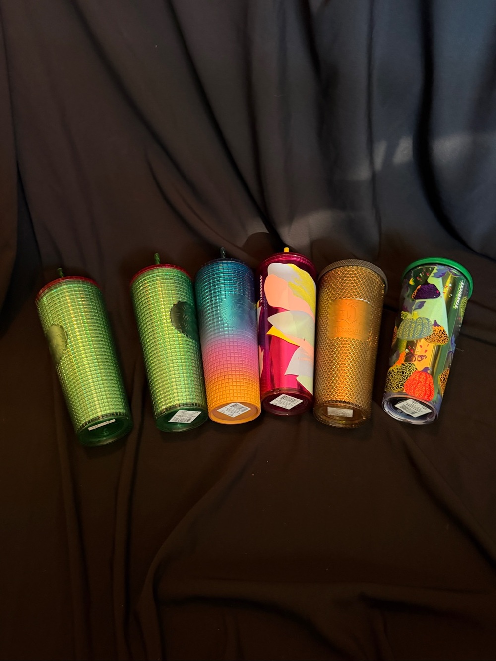 Six Starbucks cups one Disney exclusive